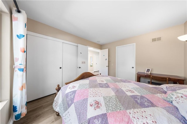11 Palos Unit 55, Irvine, CA 92612 - bedroom with wood finished floors and a closet