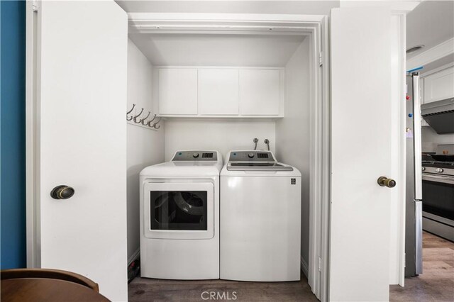 11 Palos Unit 55, Irvine, CA 92612 - washroom with independent washer and dryer, wood finished floors, and cabinet space