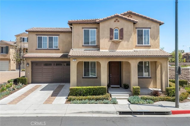 298 W Pebble Creek Ln, Orange, CA 92865 - mediterranean / spanish-style house featuring stucco siding, a tile roof, concrete driveway, and an attached garage