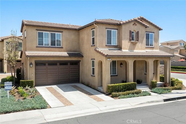 298 W Pebble Creek Ln, Orange, CA 92865 - mediterranean / spanish-style house featuring stucco siding, covered porch, a garage, and a tile roof