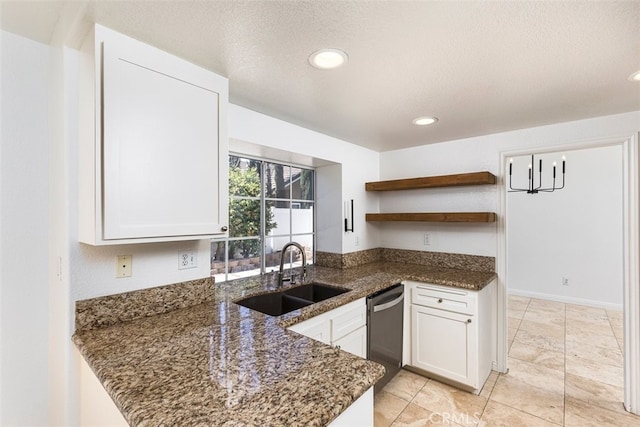 28705 Bridge Water Ln, Menifee, CA 92584 - kitchen with dishwasher, open shelves, dark stone counters, white cabinets, and a textured ceiling