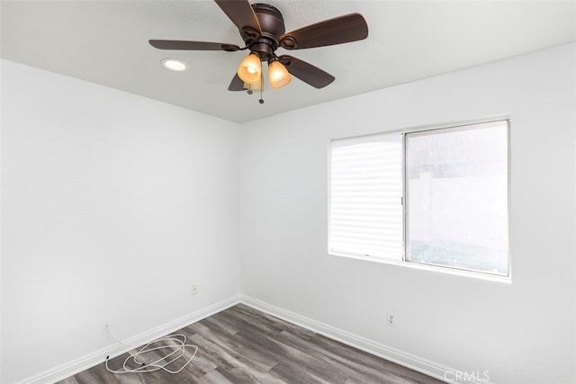 28705 Bridge Water Ln, Menifee, CA 92584 - empty room with dark wood-style floors and a ceiling fan