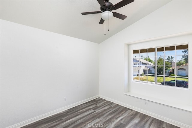 28705 Bridge Water Ln, Menifee, CA 92584 - spare room with dark wood-style flooring, vaulted ceiling, and ceiling fan