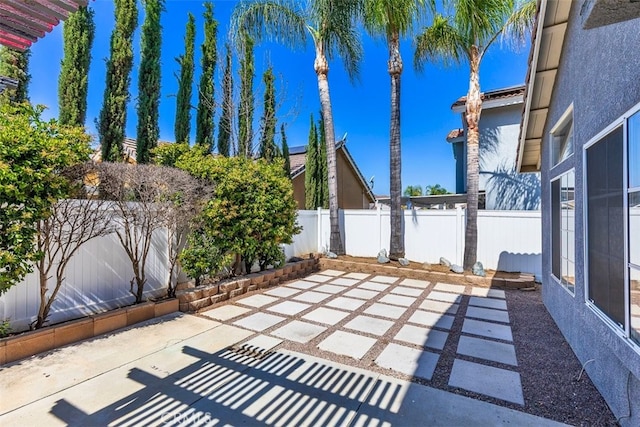 28705 Bridge Water Ln, Menifee, CA 92584 - fenced backyard with a patio area