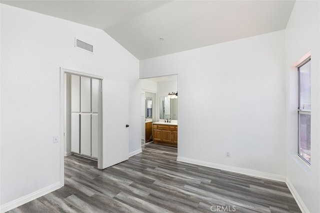 28705 Bridge Water Ln, Menifee, CA 92584 - unfurnished bedroom featuring dark wood-style floors, high vaulted ceiling, and ensuite bathroom