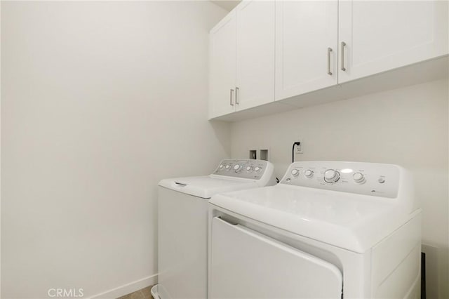 175 Cadence, Irvine, CA 92618 - washroom with cabinet space, washer and clothes dryer, and baseboards