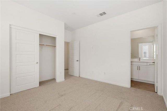 175 Cadence, Irvine, CA 92618 - unfurnished bedroom featuring carpet, a closet, ensuite bathroom, baseboards, and a sink
