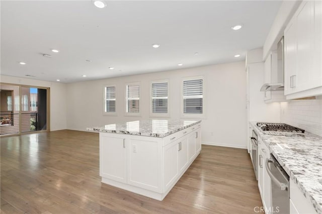 175 Cadence, Irvine, CA 92618 - kitchen featuring appliances with stainless steel finishes, backsplash, plenty of natural light, white cabinetry, and recessed lighting