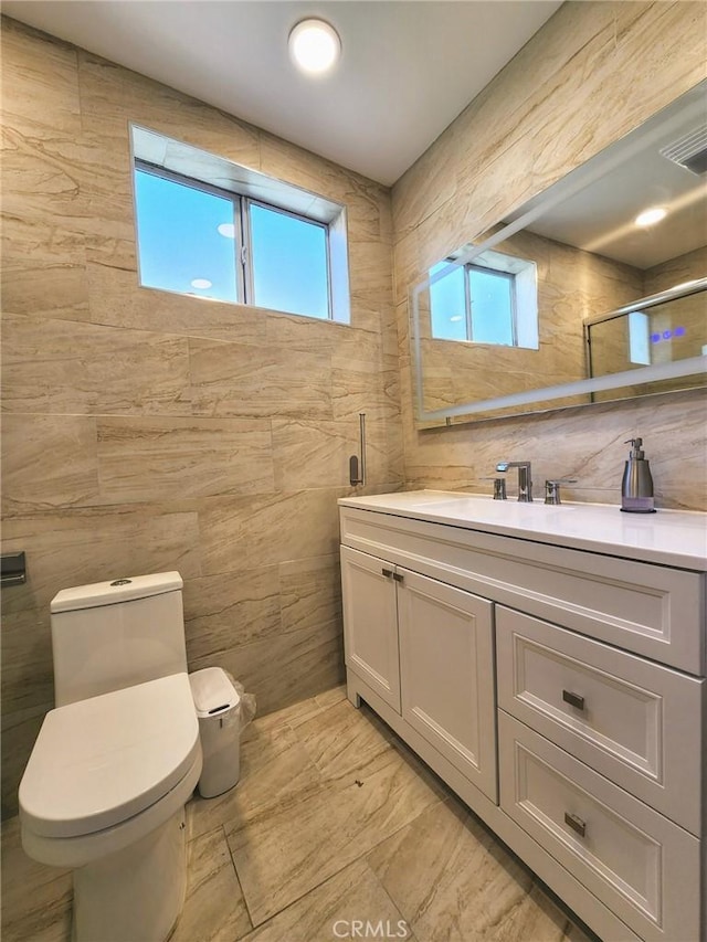 4297 Moonstone Dr, Los Angeles, CA 90032 - bathroom featuring tile walls, toilet, vanity, and marble finish flooring