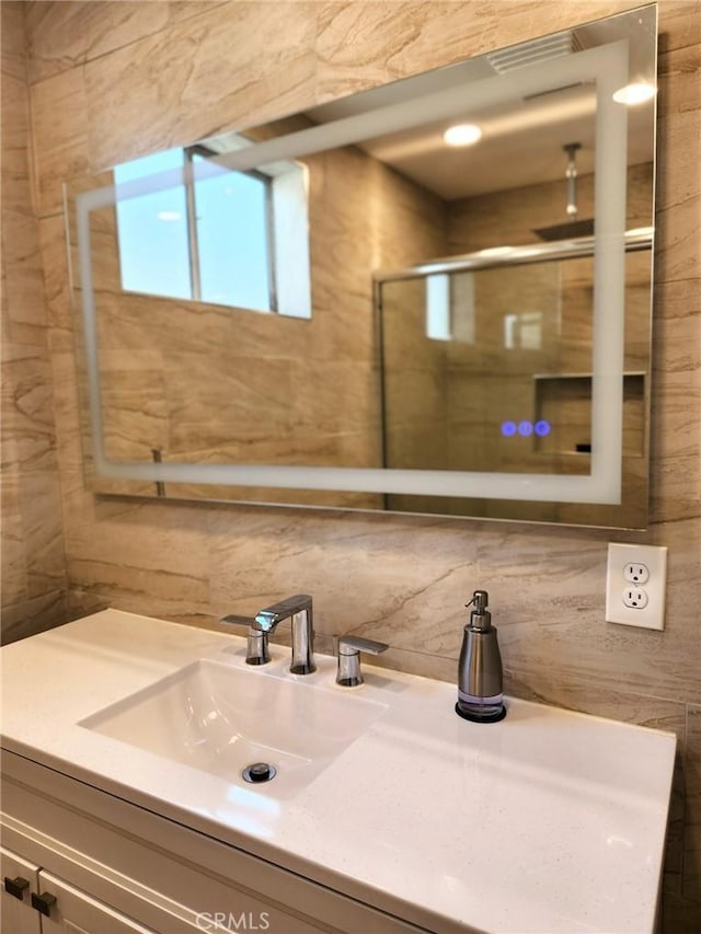 4297 Moonstone Dr, Los Angeles, CA 90032 - bathroom featuring tile walls, vanity, and tasteful backsplash