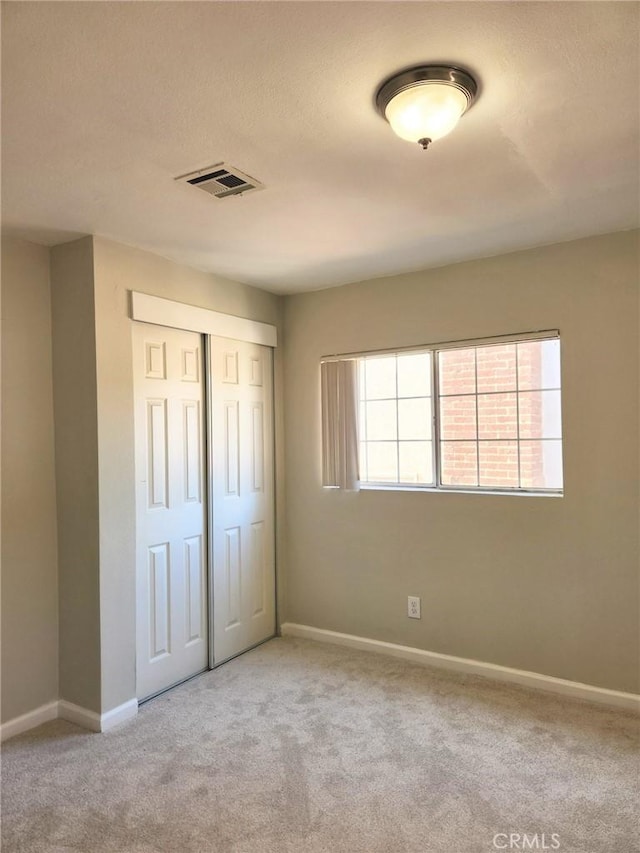4297 Moonstone Dr, Los Angeles, CA 90032 - unfurnished bedroom with carpet, a closet, and baseboards