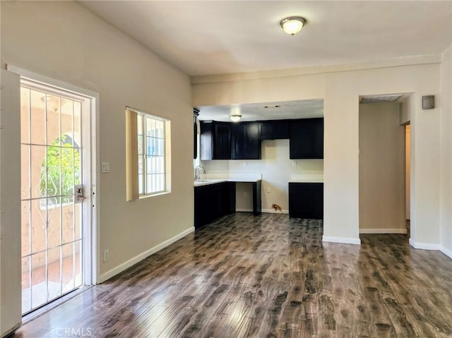 4297 Moonstone Dr, Los Angeles, CA 90032 - kitchen with dark cabinets, dark wood-style floors, baseboards, and a sink