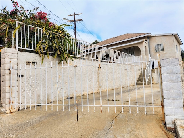 4297 Moonstone Dr, Los Angeles, CA 90032 - view of side of property with stucco siding and stairs