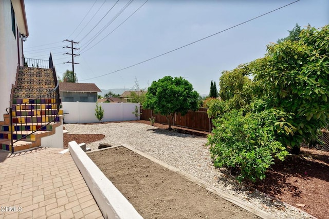 422 Foothill Dr, Fillmore, CA 93015 - fenced backyard with stairs and a patio