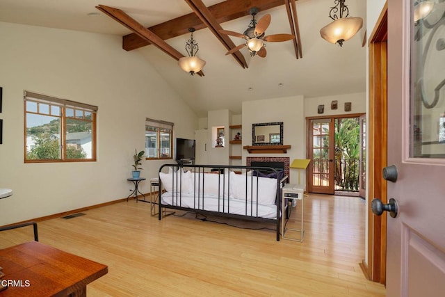 422 Foothill Dr, Fillmore, CA 93015 - living area with beam ceiling, ceiling fan, light wood-style flooring, plenty of natural light, and a brick fireplace