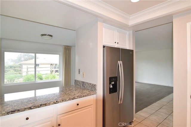 5369 Algarrobo Unit 1G, Laguna Woods, CA 92637 - kitchen featuring stainless steel fridge with ice dispenser, ornamental molding, light tile patterned flooring, light stone countertops, and white cabinetry