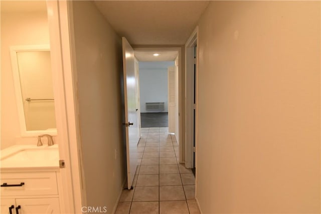 5369 Algarrobo Unit 1G, Laguna Woods, CA 92637 - hall featuring a sink, light tile patterned floors, recessed lighting, and baseboards