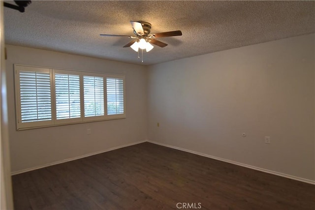 5369 Algarrobo Unit 1G, Laguna Woods, CA 92637 - unfurnished room featuring a ceiling fan, dark wood-style floors, a textured ceiling, and baseboards
