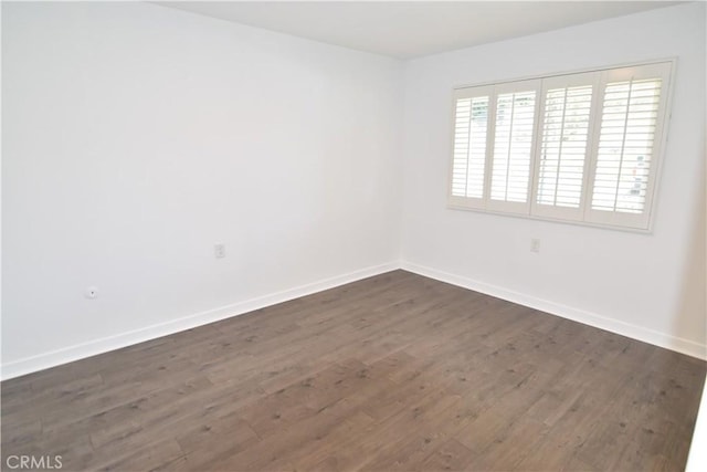 5369 Algarrobo Unit 1G, Laguna Woods, CA 92637 - unfurnished room featuring dark wood-style flooring and baseboards