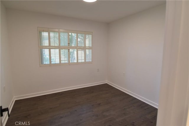 5369 Algarrobo Unit 1G, Laguna Woods, CA 92637 - unfurnished room featuring dark wood finished floors and baseboards