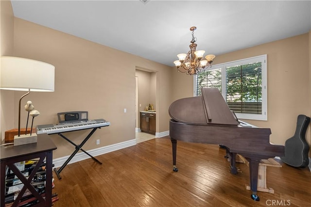 29012 Madrid Pl, Castaic, CA 91384 - sitting room featuring wood finished floors, a chandelier, and baseboards
