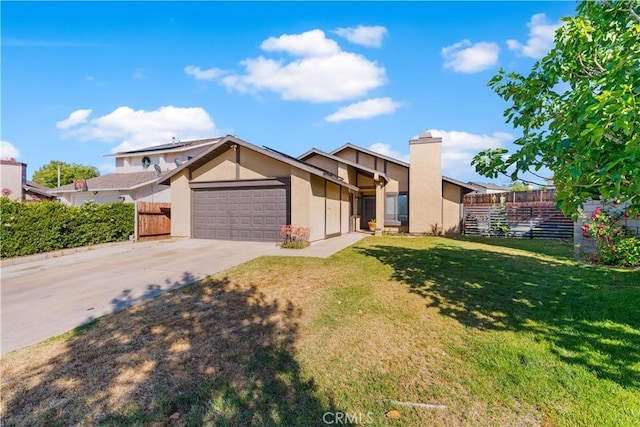 4846 Karling Pl, Palmdale, CA 93552 - mid-century modern home with an attached garage, concrete driveway, stucco siding, and a chimney