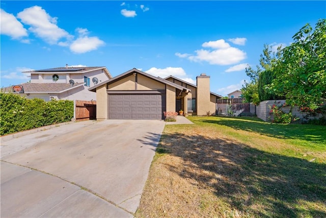4846 Karling Pl, Palmdale, CA 93552 - view of front of house with a garage, driveway, stucco siding, and a chimney