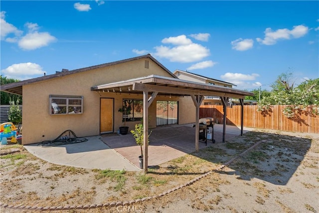 4846 Karling Pl, Palmdale, CA 93552 - rear view of house with stucco siding, a fenced backyard, and a patio area