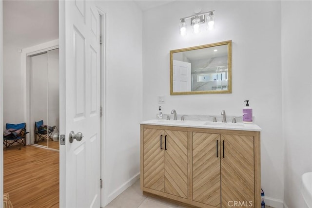 7037 Cimarron St, Los Angeles, CA 90047 - full bath featuring double vanity and wood finished floors