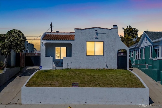 7037 Cimarron St, Los Angeles, CA 90047 - mediterranean / spanish-style home with stucco siding and a tiled roof