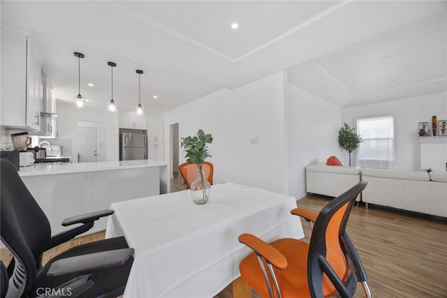 7037 Cimarron St, Los Angeles, CA 90047 - dining area featuring wood finished floors and recessed lighting