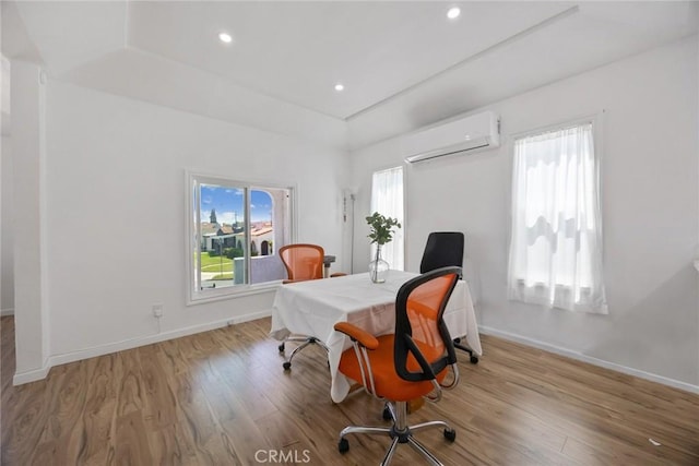 7037 Cimarron St, Los Angeles, CA 90047 - office featuring a wall mounted air conditioner, plenty of natural light, wood finished floors, recessed lighting, and a tray ceiling