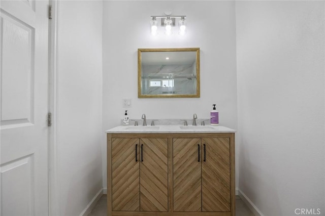 7037 Cimarron St, Los Angeles, CA 90047 - bathroom featuring double vanity and baseboards