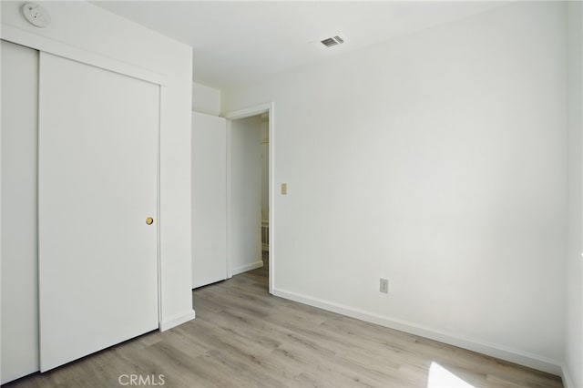7000 Verdure Way, Elk Grove, CA 95758 - unfurnished bedroom featuring light wood-style flooring, a closet, and baseboards