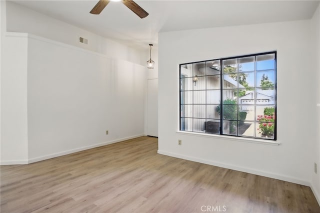 7000 Verdure Way, Elk Grove, CA 95758 - empty room featuring wood finished floors, a ceiling fan, and baseboards