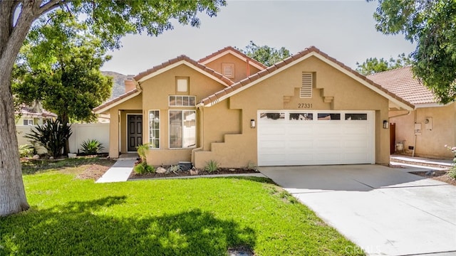 27331 Prominence Rd, Menifee, CA 92586 - view of front of house featuring a garage, stucco siding, concrete driveway, and a tile roof