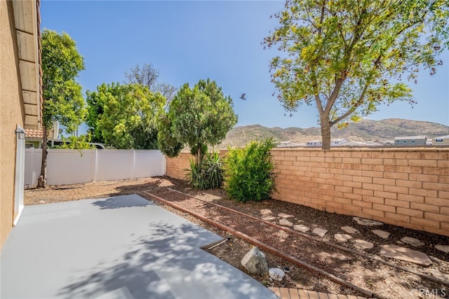 27331 Prominence Rd, Menifee, CA 92586 - fenced backyard with a mountain view and a patio area