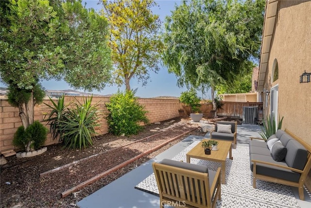 27331 Prominence Rd, Menifee, CA 92586 - fenced backyard featuring a patio area, an outdoor living space, and central AC