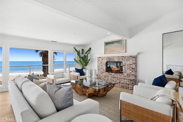 326 Boca Del Canon, San Clemente, CA 92672 - living room featuring light wood-type flooring, a water view, a brick fireplace, beam ceiling, and crown molding