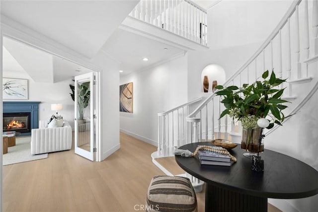 326 Boca Del Canon, San Clemente, CA 92672 - office space featuring light wood-type flooring, a glass covered fireplace, baseboards, and a high ceiling