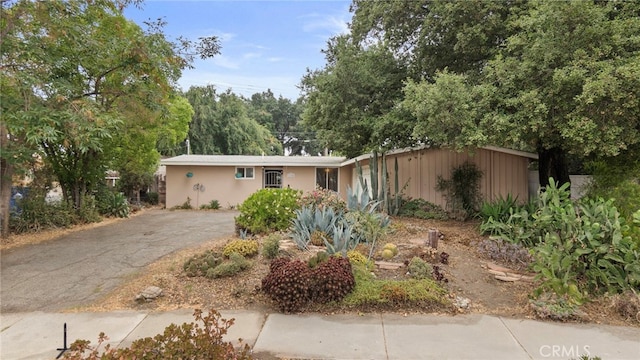 1104 W F St, Ontario, CA 91762 - ranch-style house featuring asphalt driveway and stucco siding