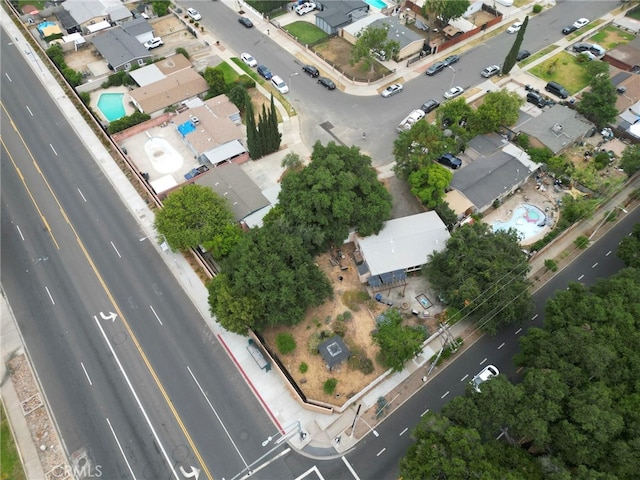 1104 W F St, Ontario, CA 91762 - aerial view of property and surrounding area featuring nearby suburban area and property parcel outlined