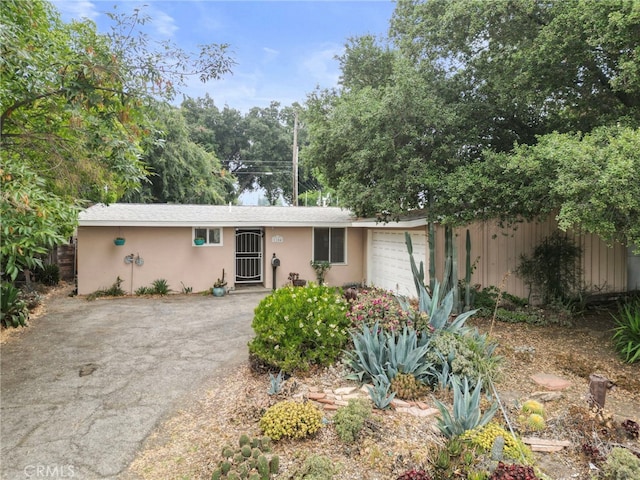 1104 W F St, Ontario, CA 91762 - single story home featuring a garage, driveway, and stucco siding