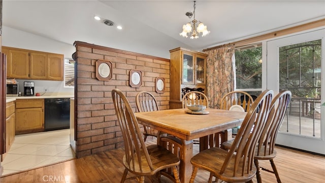 1104 W F St, Ontario, CA 91762 - dining room featuring vaulted ceiling, a chandelier, and light wood finished floors
