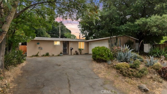 1104 W F St, Ontario, CA 91762 - ranch-style home with stucco siding, driveway, and a garage