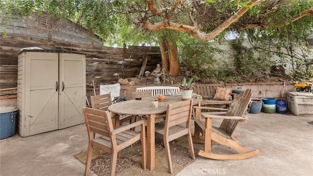 1104 W F St, Ontario, CA 91762 - view of patio / terrace with outdoor dining area and a storage shed