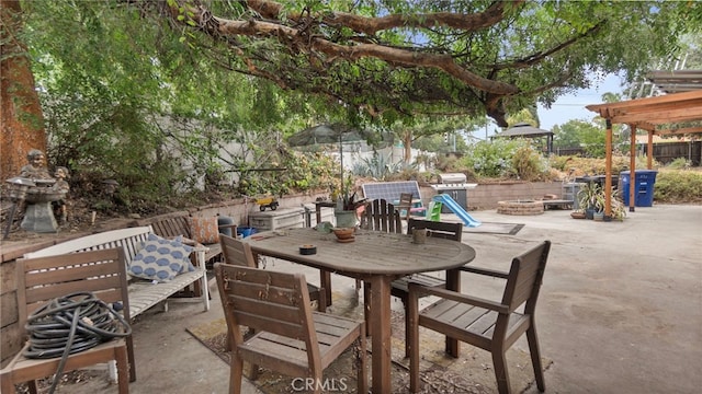 1104 W F St, Ontario, CA 91762 - view of patio with an outdoor fire pit, outdoor dining area, and a grill