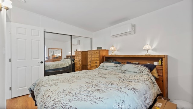 1104 W F St, Ontario, CA 91762 - bedroom with an AC wall unit, lofted ceiling, a closet, and wood finished floors
