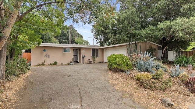 1104 W F St, Ontario, CA 91762 - single story home featuring driveway, stucco siding, and an attached garage