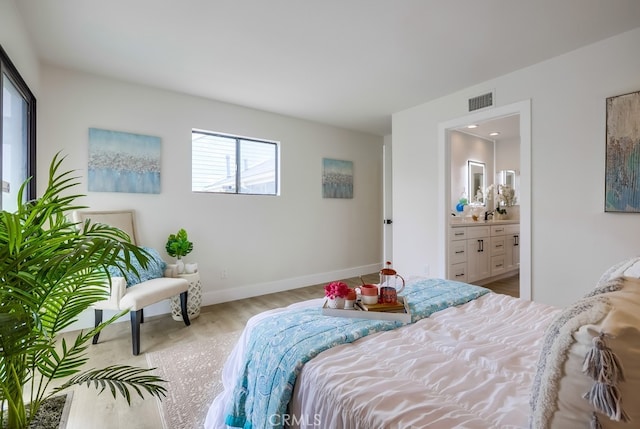 658 S Webster Ave Unit 4, Anaheim, CA 92804 - bedroom featuring ensuite bath, wood finished floors, and baseboards
